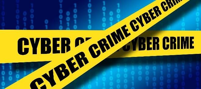 Blue background with yellow caution tape crossed that says cyber crime in black text.